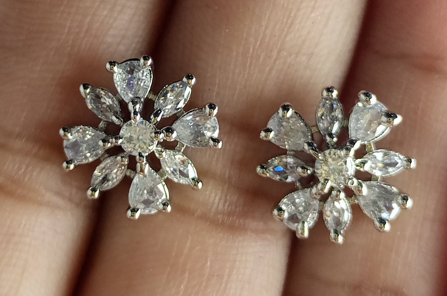 The diamond cut studs rhodium plated luxury earrings
