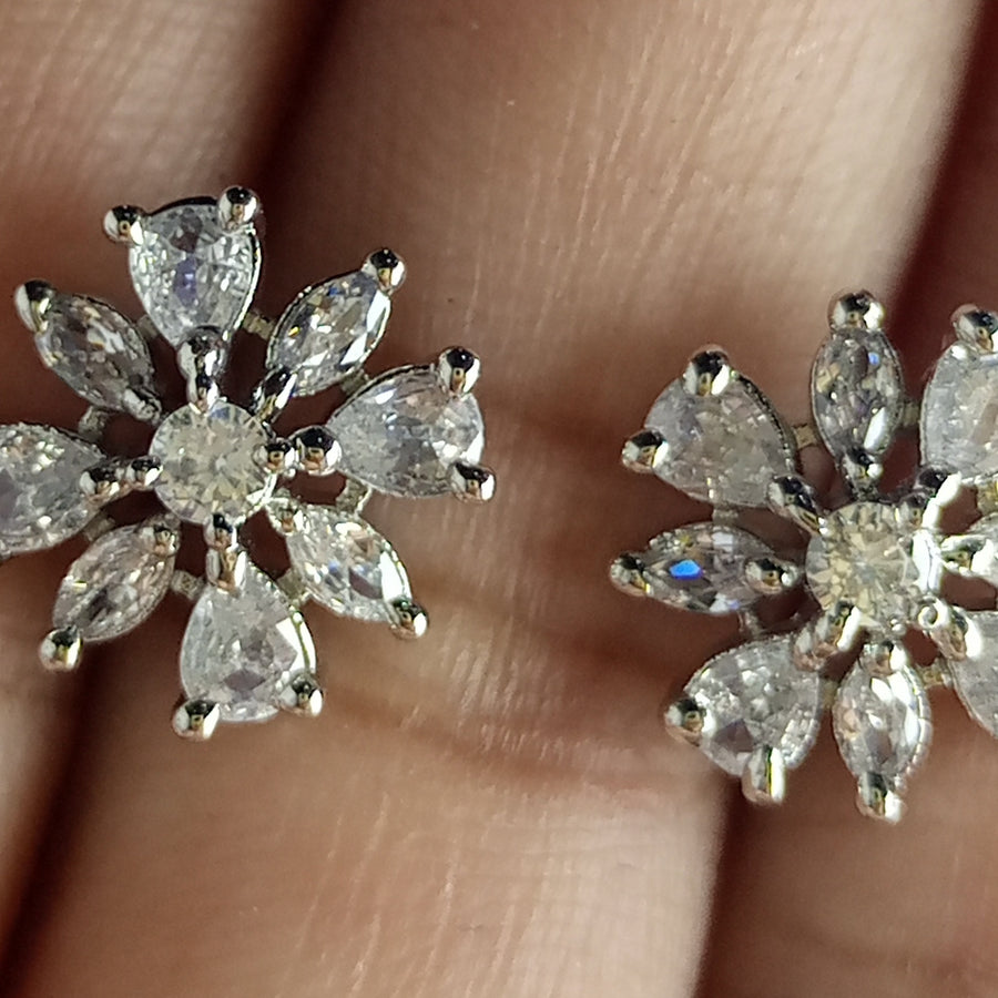 The diamond cut studs rhodium plated luxury earrings