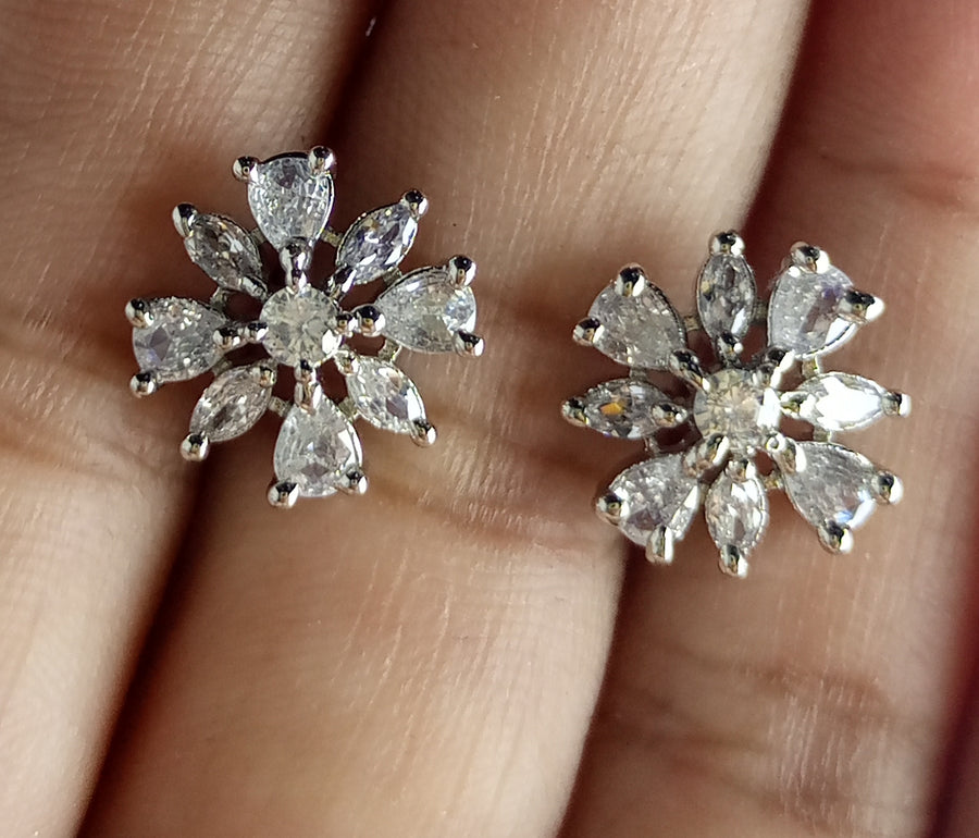 The diamond cut studs rhodium plated luxury earrings