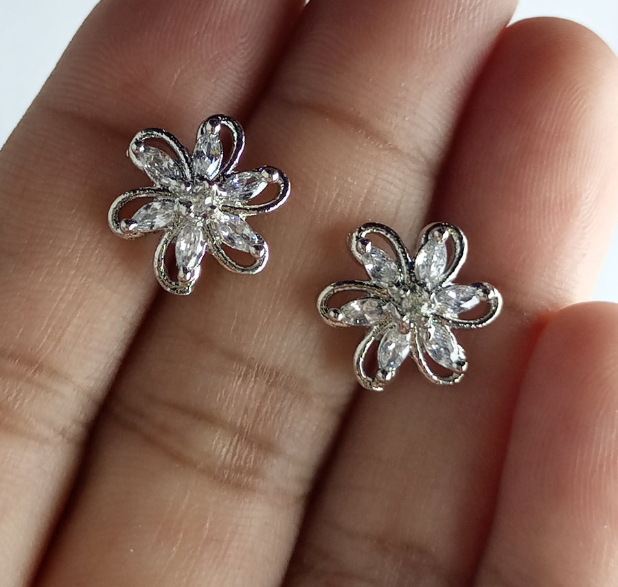 The diamond cut studs rhodium plated luxury earrings