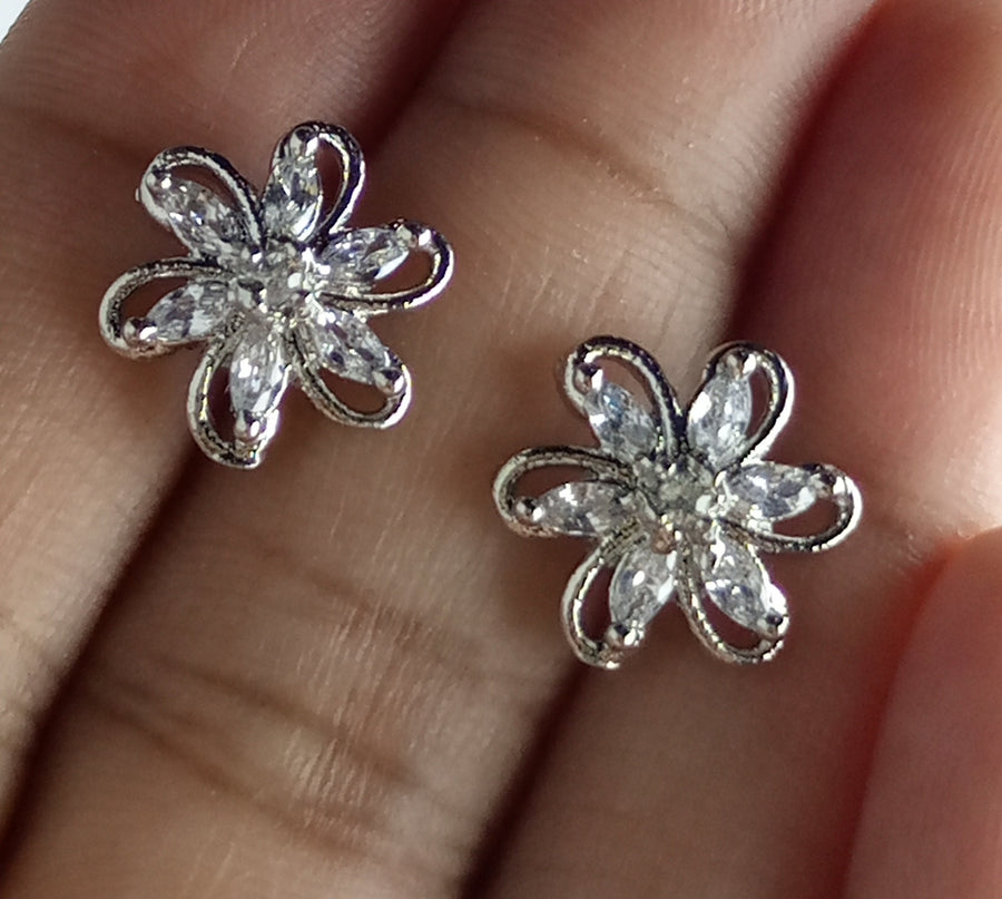 The diamond cut studs rhodium plated luxury earrings