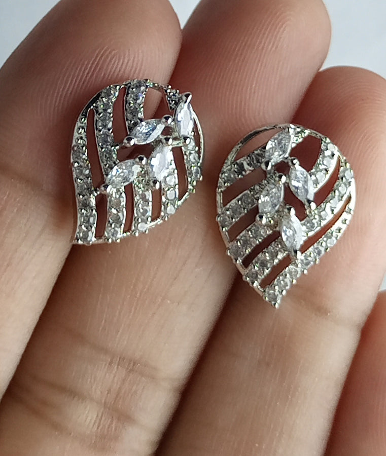 The diamond cut studs rhodium plated luxury earrings