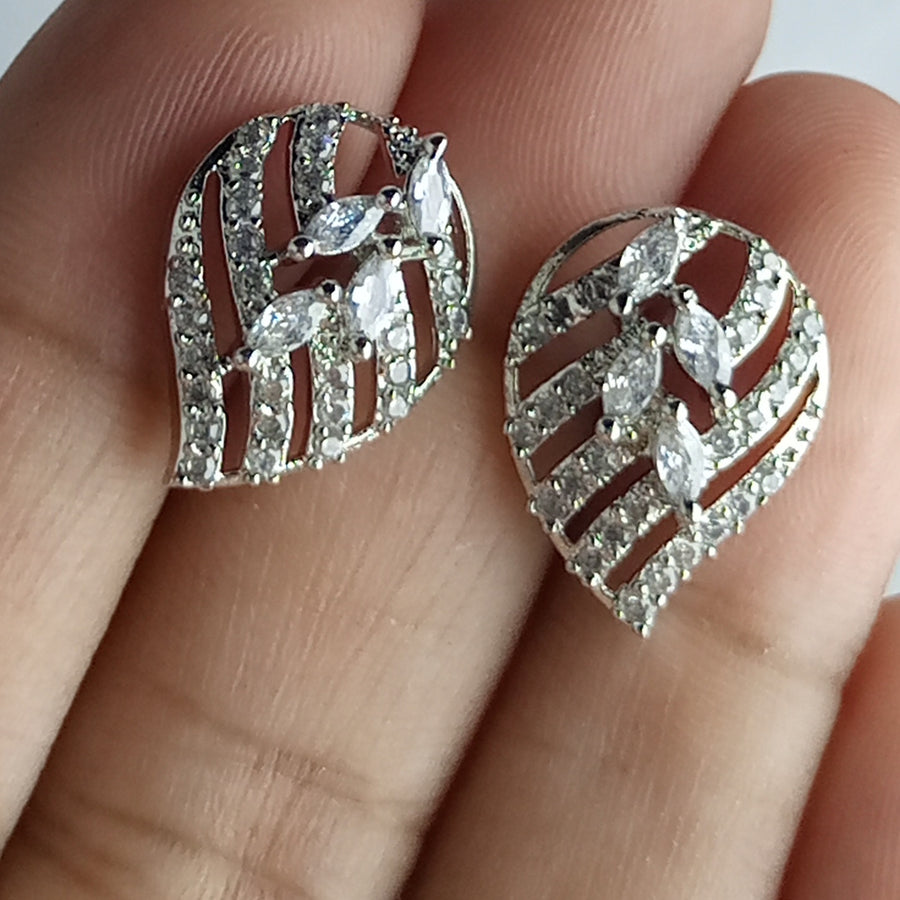 The diamond cut studs rhodium plated luxury earrings