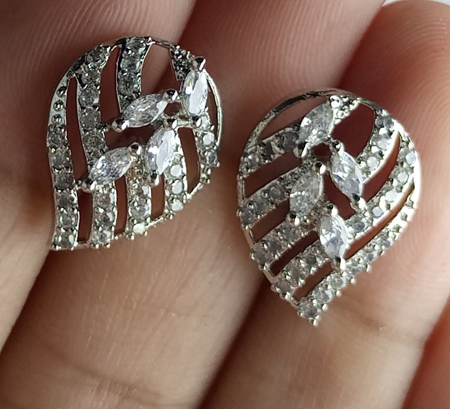 The diamond cut studs rhodium plated luxury earrings